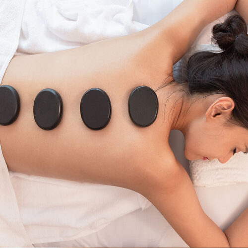 Asian-Woman-getting-Hot-Stone-Massage